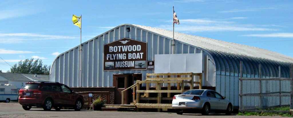 A large building with a sign that reads, "Botwood Flying Boat Museum".